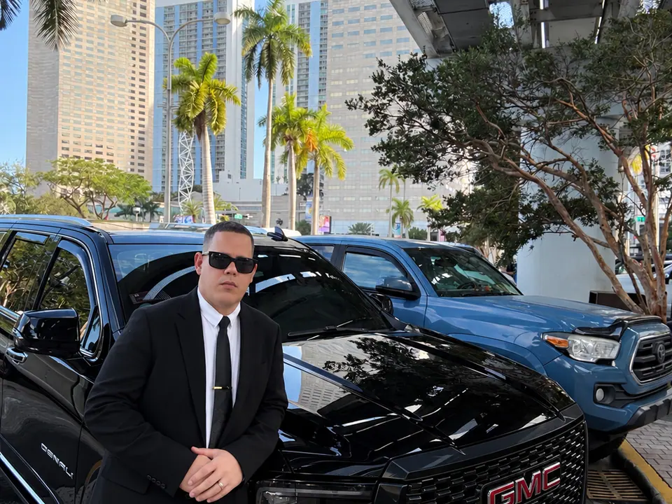 Yonan Valladares beside the GMC Yukon XL Denali in Miami